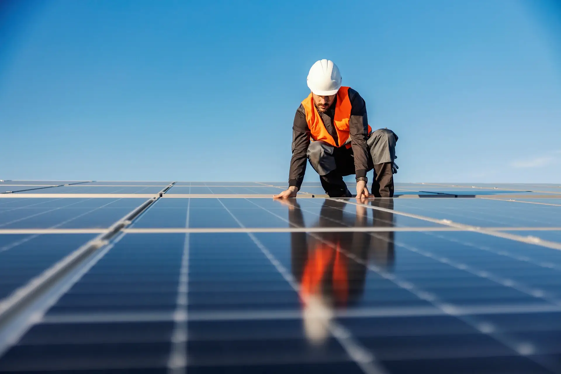 Man working and providing a solar panel installation.
